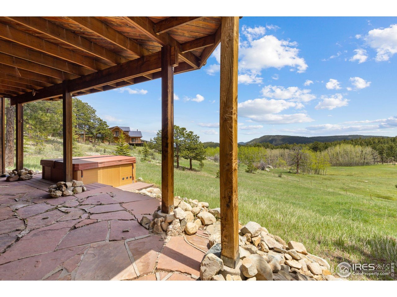 1117 Rock Lake Road Ward, CO 80481 - Photo 31 of 40 Walk-out basement patio with hot tub. Soak and relax under the stars!