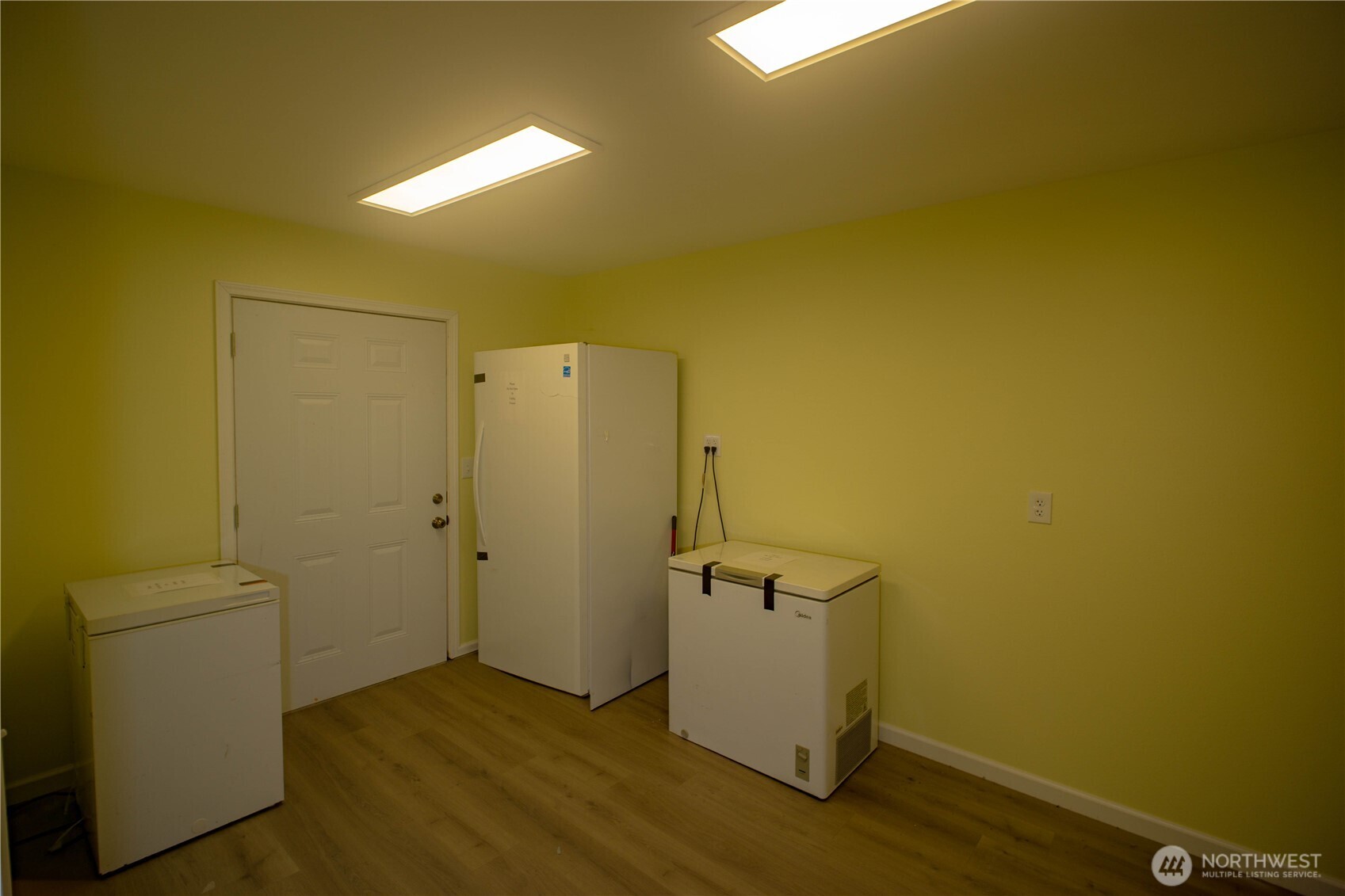 89 Slab Camp Road Sequim, WA 98382 - Photo 27 of 40 a view of water heater room with wooden floor