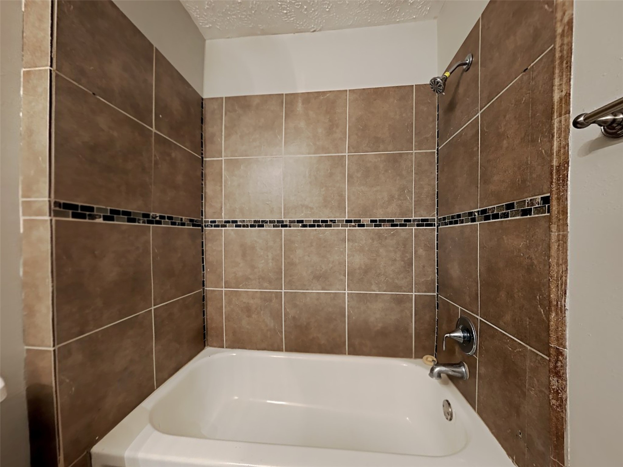 7306 Ridgeberry Drive Houston, TX 77095 - Photo 14 of 16 a bathroom with a bathtub