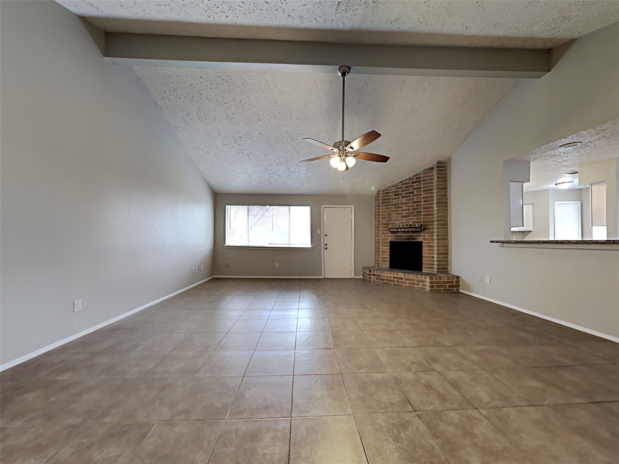 7306 Ridgeberry Drive Houston, TX 77095 - Photo 2 of 16 a view of empty room with window and fireplace