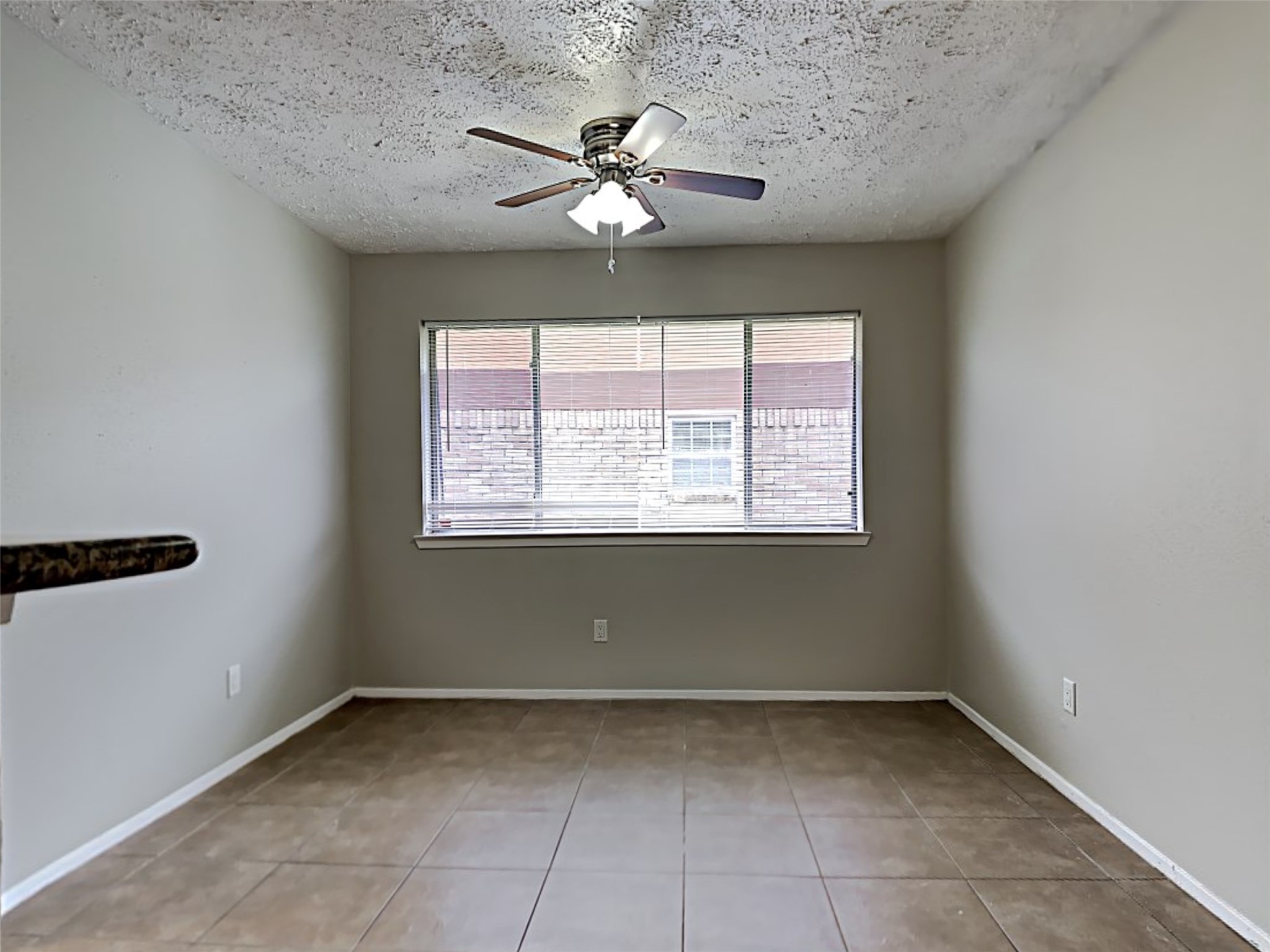 7306 Ridgeberry Drive Houston, TX 77095 - Photo 4 of 16 a view of an empty room with a window