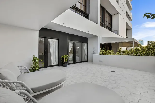 a view of a terrace with couches and potted plants