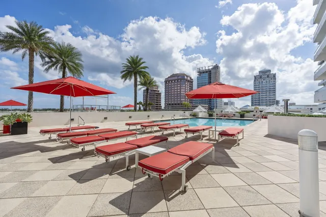 a view of a patio with a dining table and chairs
