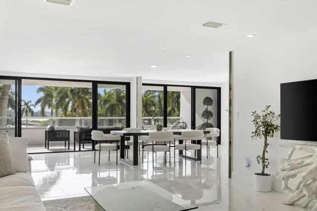 a lobby with furniture and large windows