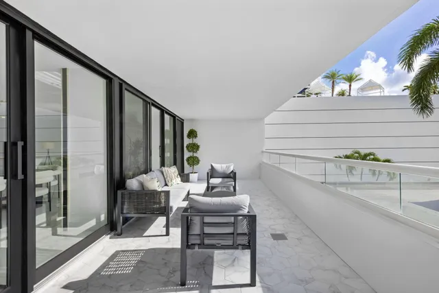 a view of balcony with furniture