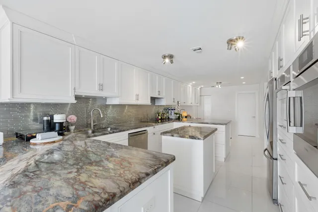 a kitchen with a sink stove and refrigerator