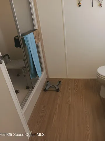 a bedroom with a bed and a lamp