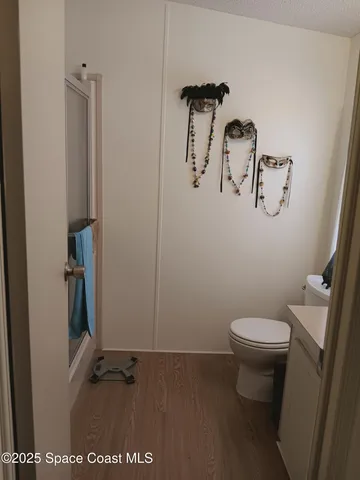 a bedroom with a bed and a chair