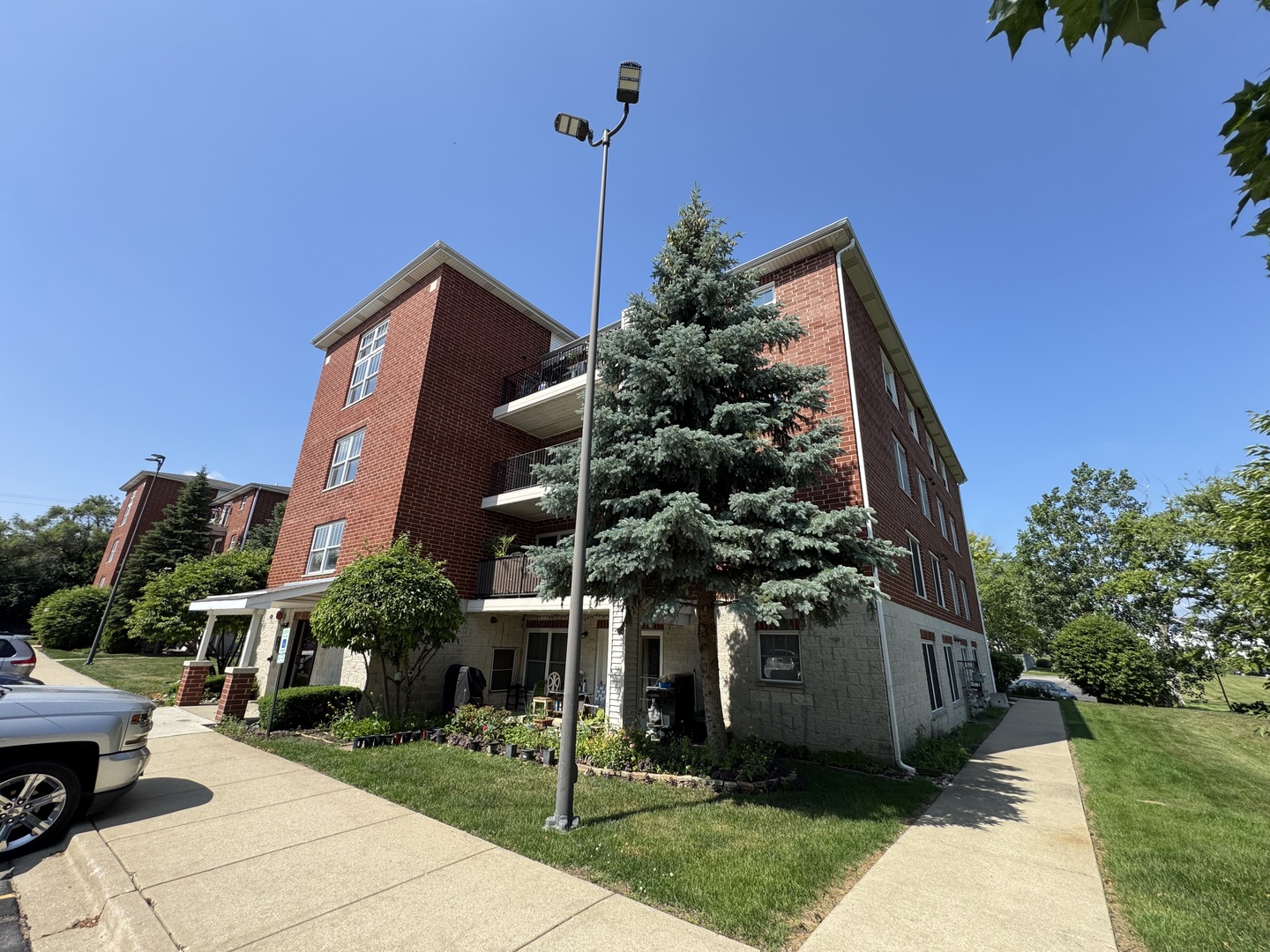 237 North Mill Road, Unit 14 Addison, IL 60101 - Photo 15 of 15 a front view of a house with a yard