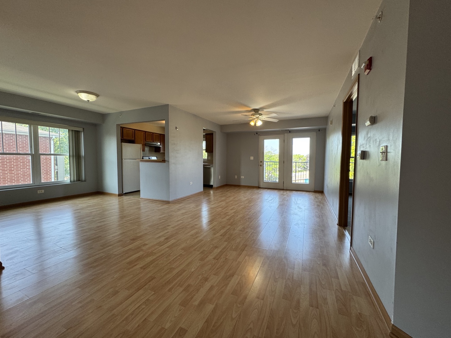 237 North Mill Road, Unit 14 Addison, IL 60101 - Photo 2 of 15 wooden floor in an empty room with a window