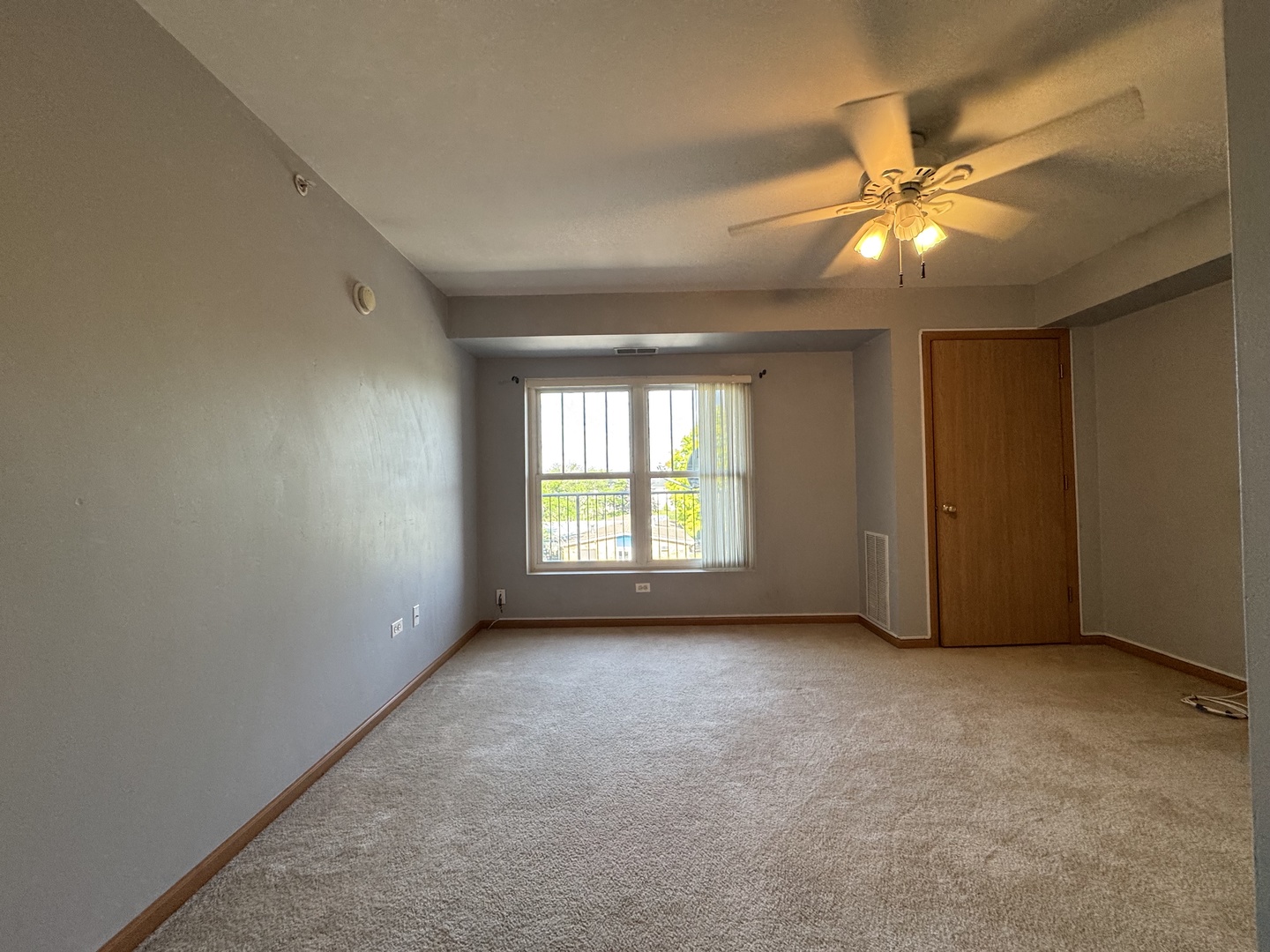 237 North Mill Road, Unit 14 Addison, IL 60101 - Photo 7 of 15 a view of an empty room with a window