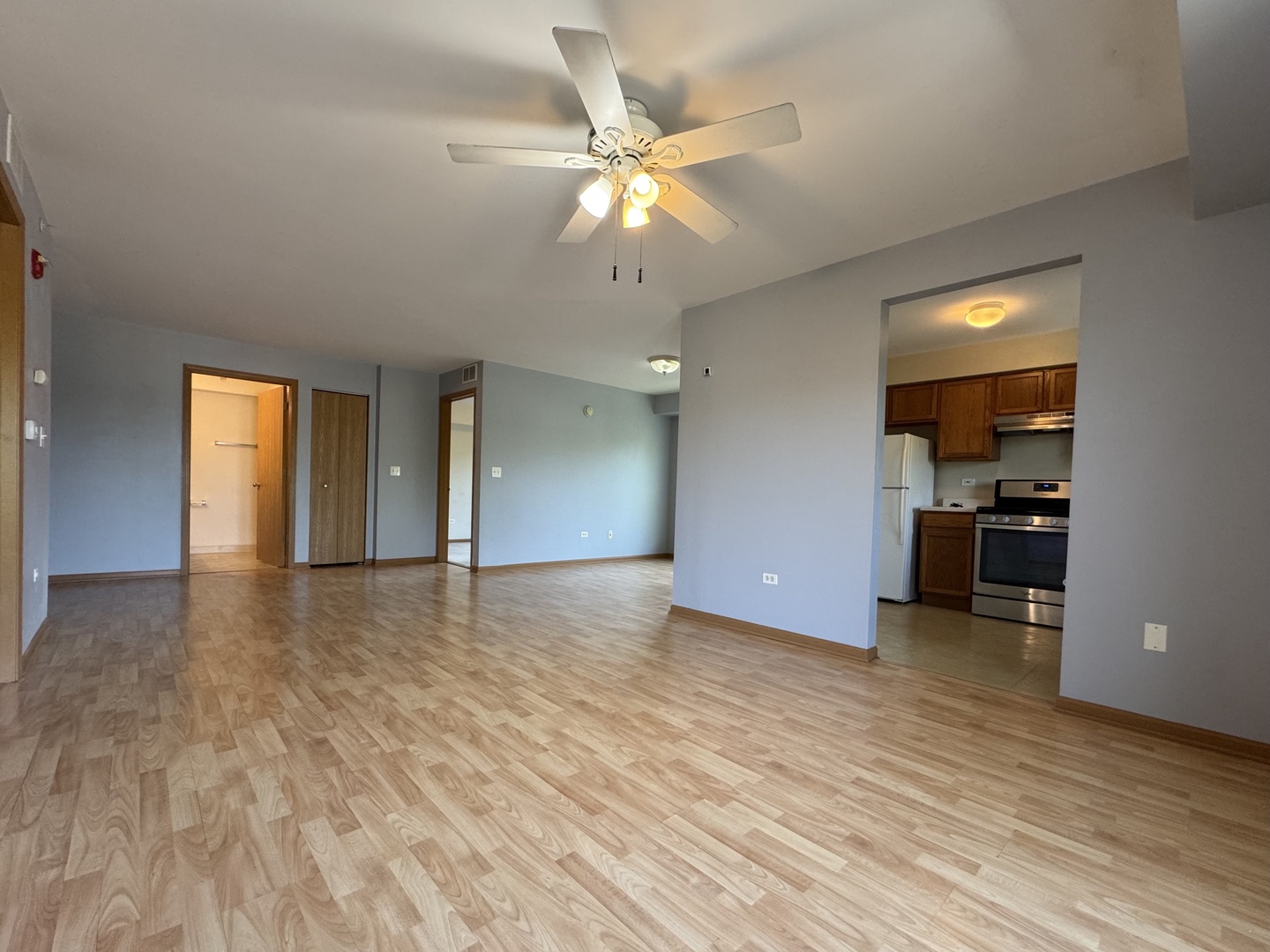 237 North Mill Road, Unit 14 Addison, IL 60101 - Photo 10 of 15 a view of empty room with wooden floor and ceiling fan