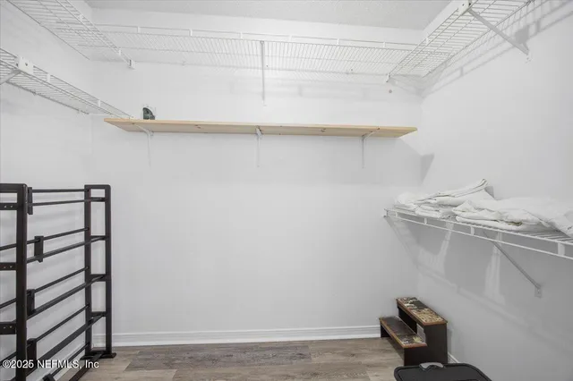 a view of a room with shelf on the wall