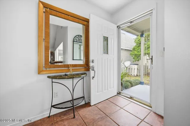a view of a door and chair in a room
