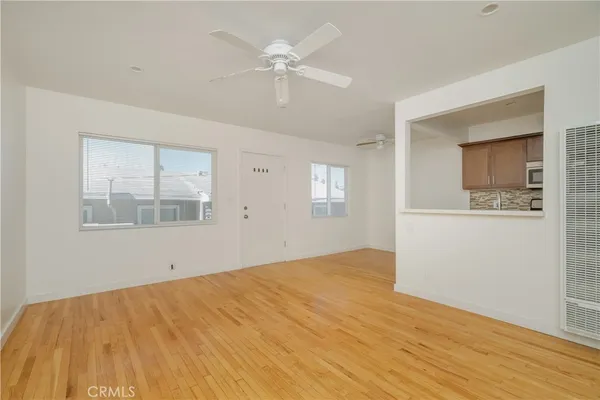a view of a kitchen with microwave and a stove