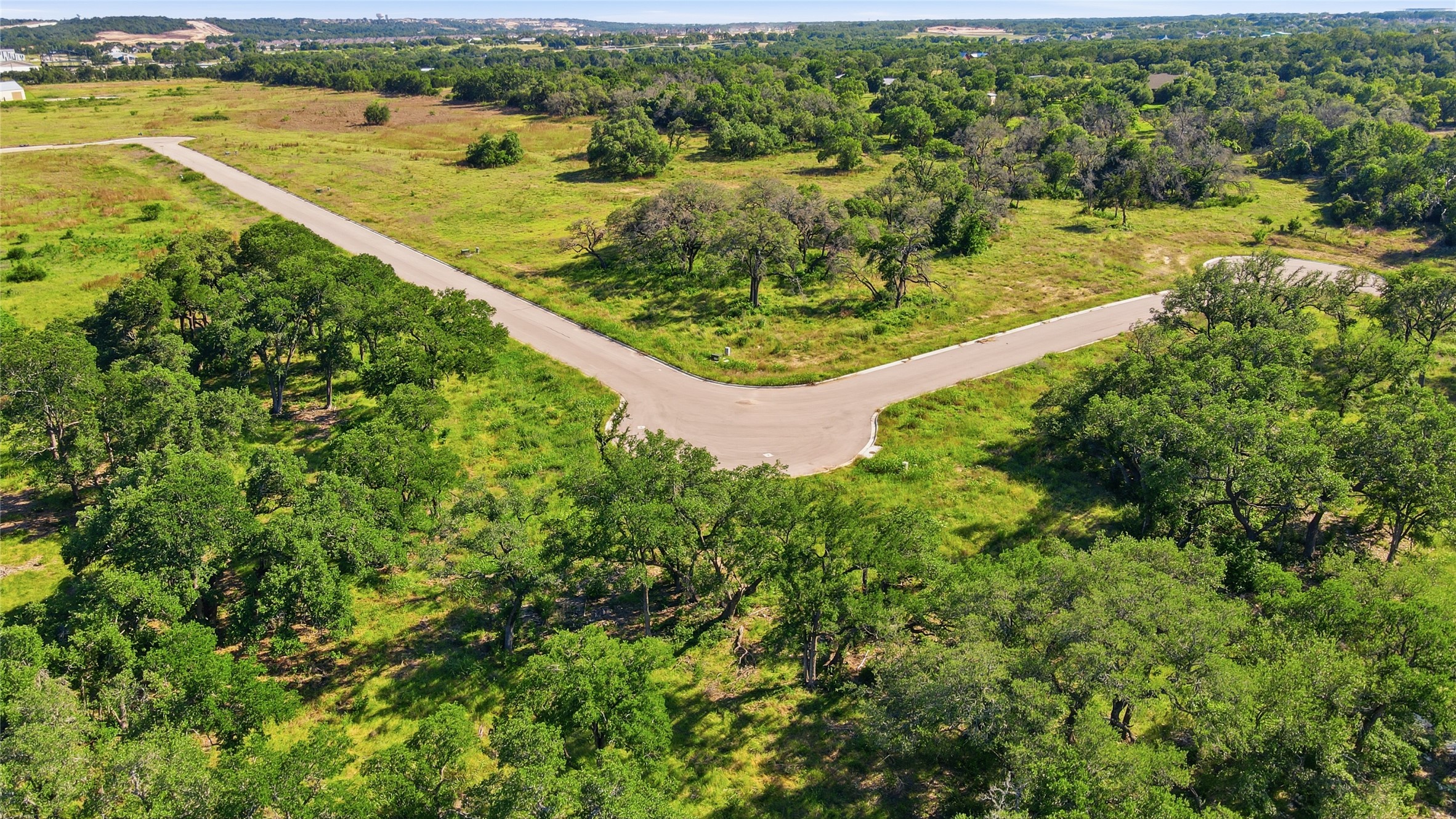 152 West Rio Rnch Road Liberty Hill, TX 78642 - Photo 17 of 27 a view of a lake with a big yard