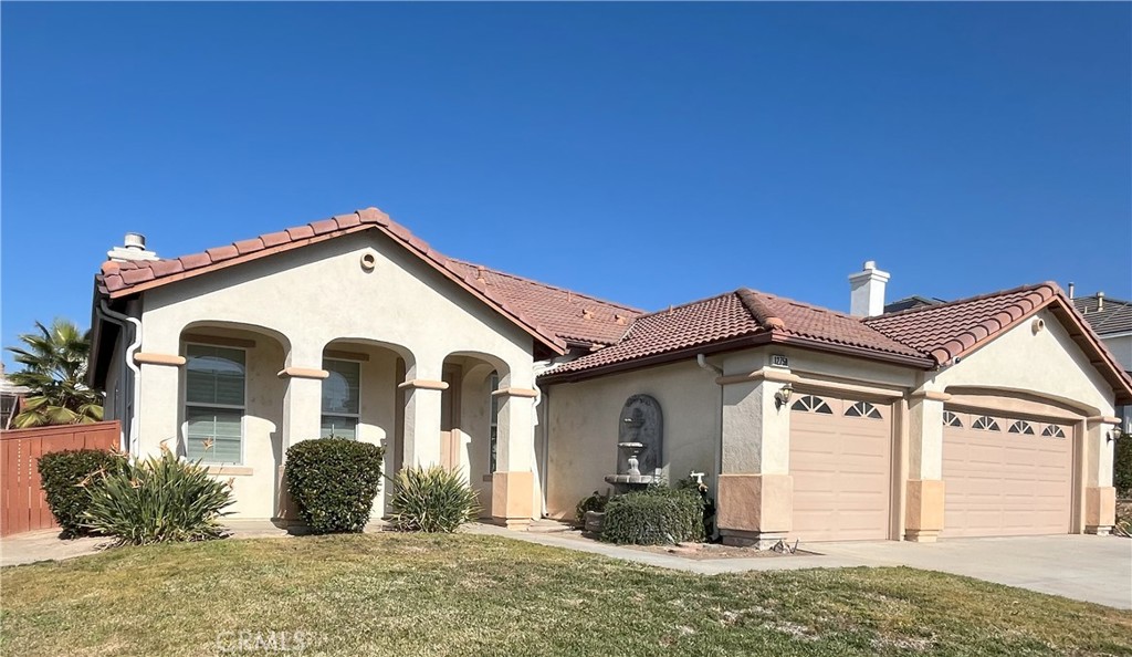 12758 Royal Palm Lane Riverside, CA 92503 - Photo 2 of 16 a view of a house with a yard