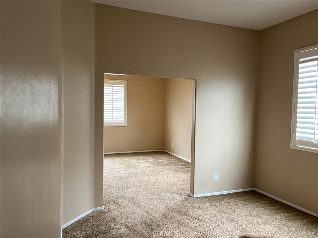 12758 Royal Palm Lane Riverside, CA 92503 - Photo 8 of 16 an empty room with windows