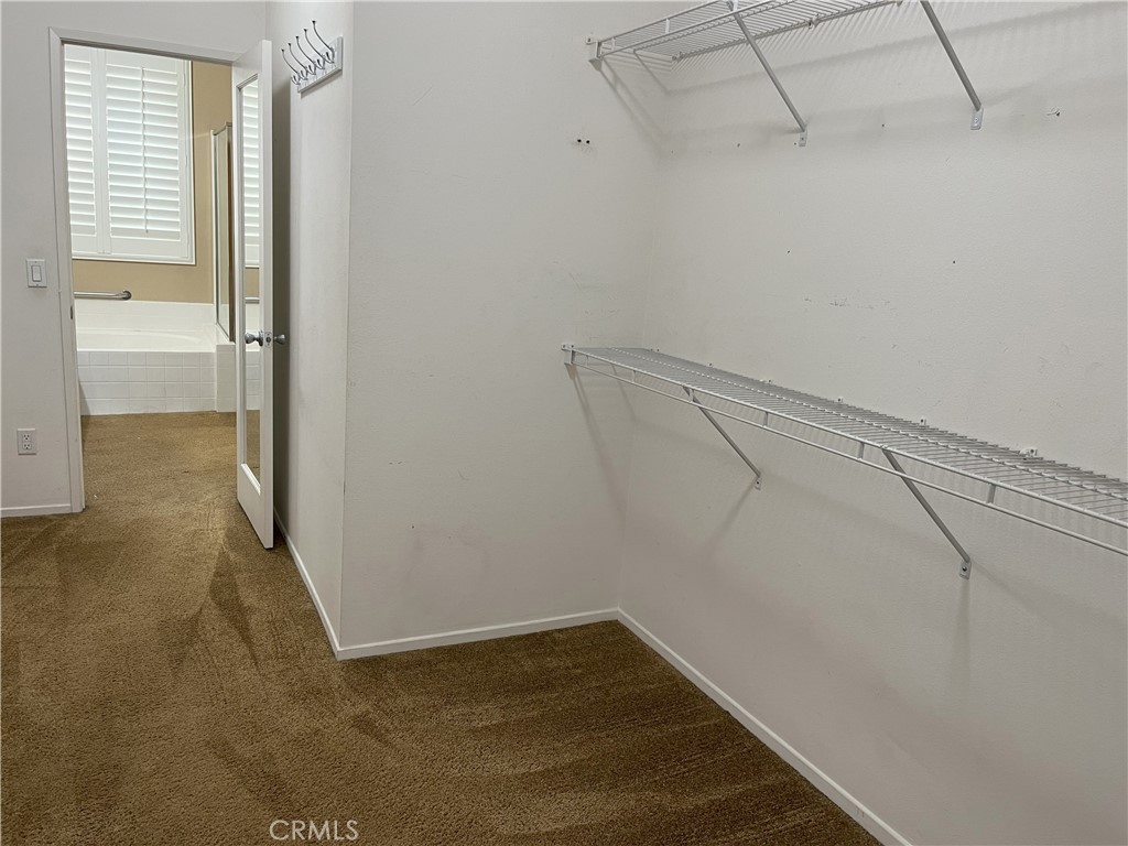 12758 Royal Palm Lane Riverside, CA 92503 - Photo 10 of 16 a view of a room with racks on the wall