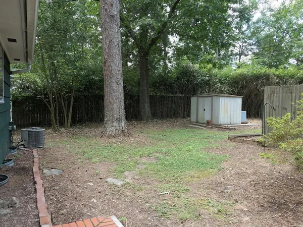 a backyard of a house with lots of green space