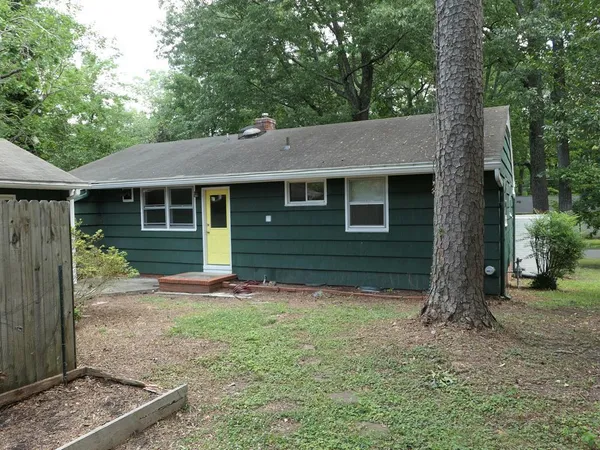 a backyard of a house with lots of green space