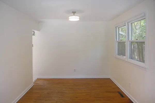a view of an empty room with a window