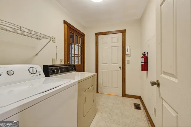 a utility room with dryer and washer