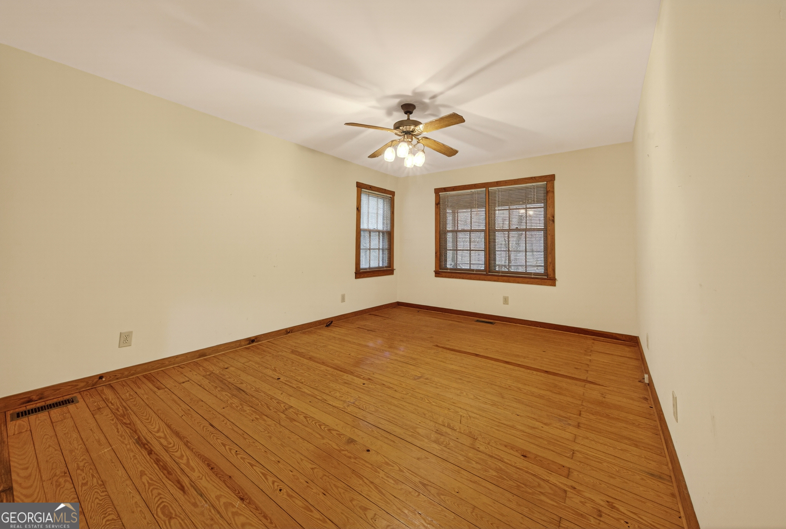 1165 Sparks Branch Road Hiawassee, GA 30546 - Photo 13 of 31 wooden floor in an empty room with a window