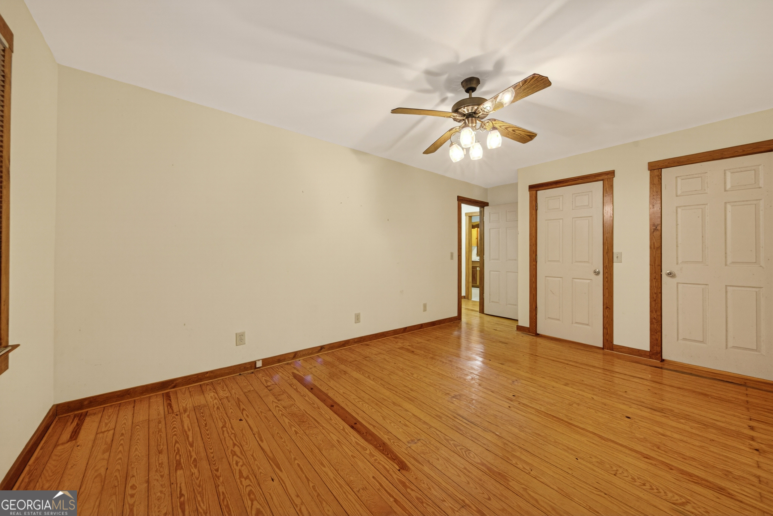 1165 Sparks Branch Road Hiawassee, GA 30546 - Photo 14 of 31 a view of an empty room with window and wooden floor