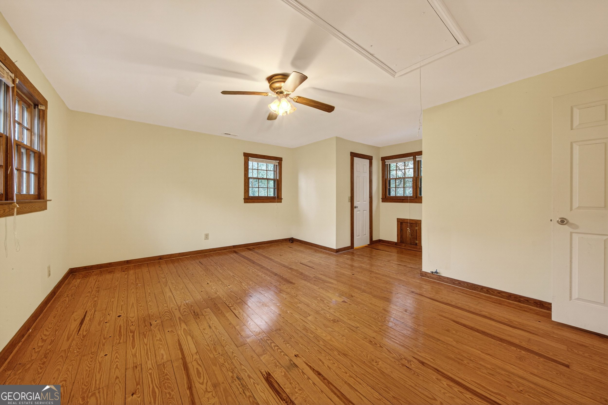 1165 Sparks Branch Road Hiawassee, GA 30546 - Photo 16 of 31 a view of empty room with wooden floor and fan