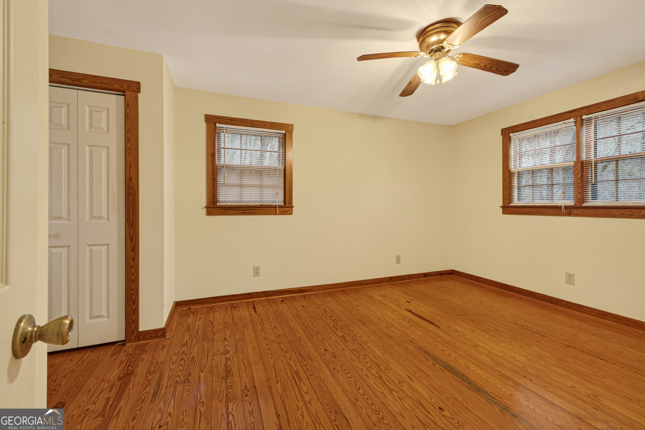 1165 Sparks Branch Road Hiawassee, GA 30546 - Photo 18 of 31 a view of empty room with wooden floor and fan