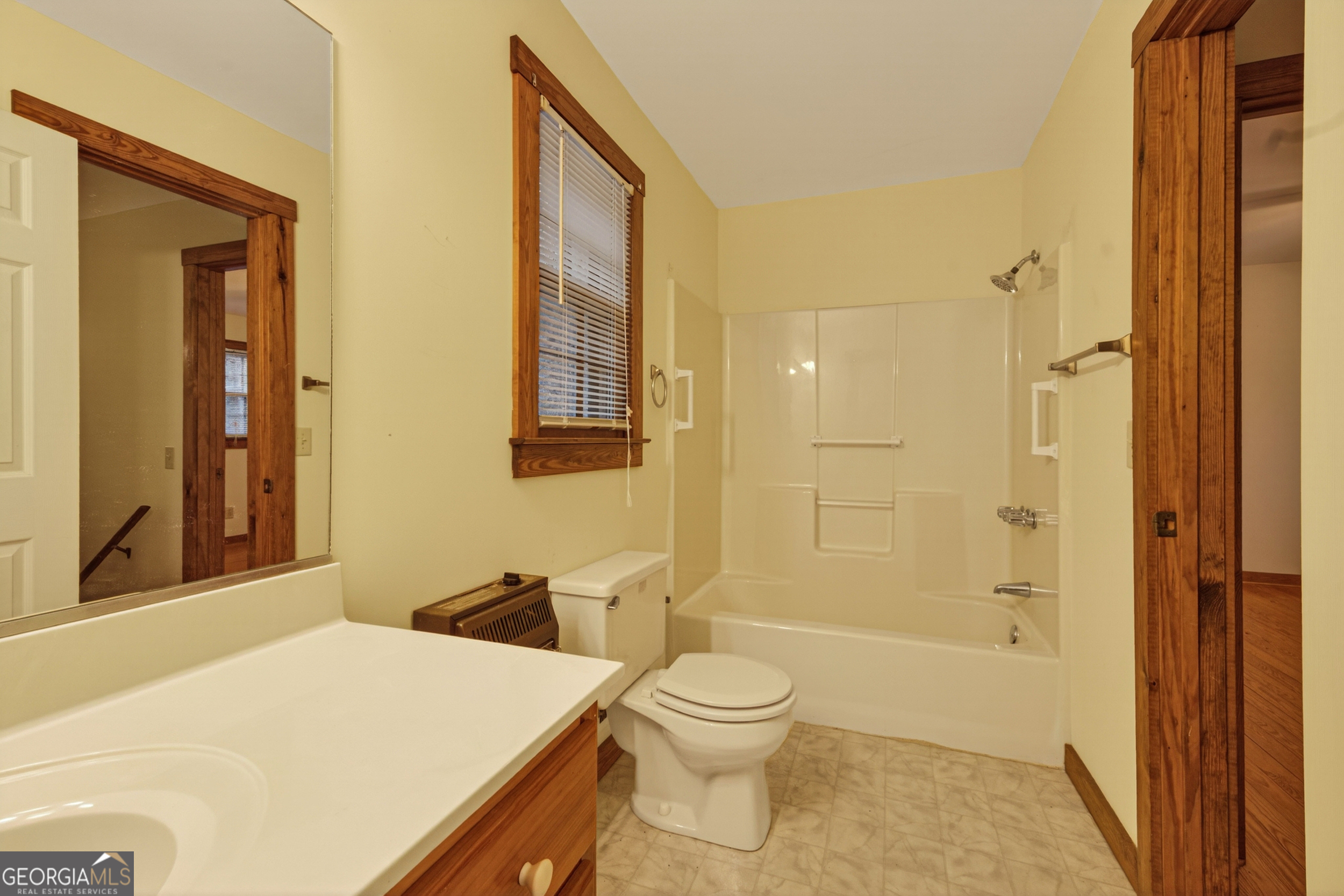 1165 Sparks Branch Road Hiawassee, GA 30546 - Photo 19 of 31 a bathroom with a sink a toilet and shower