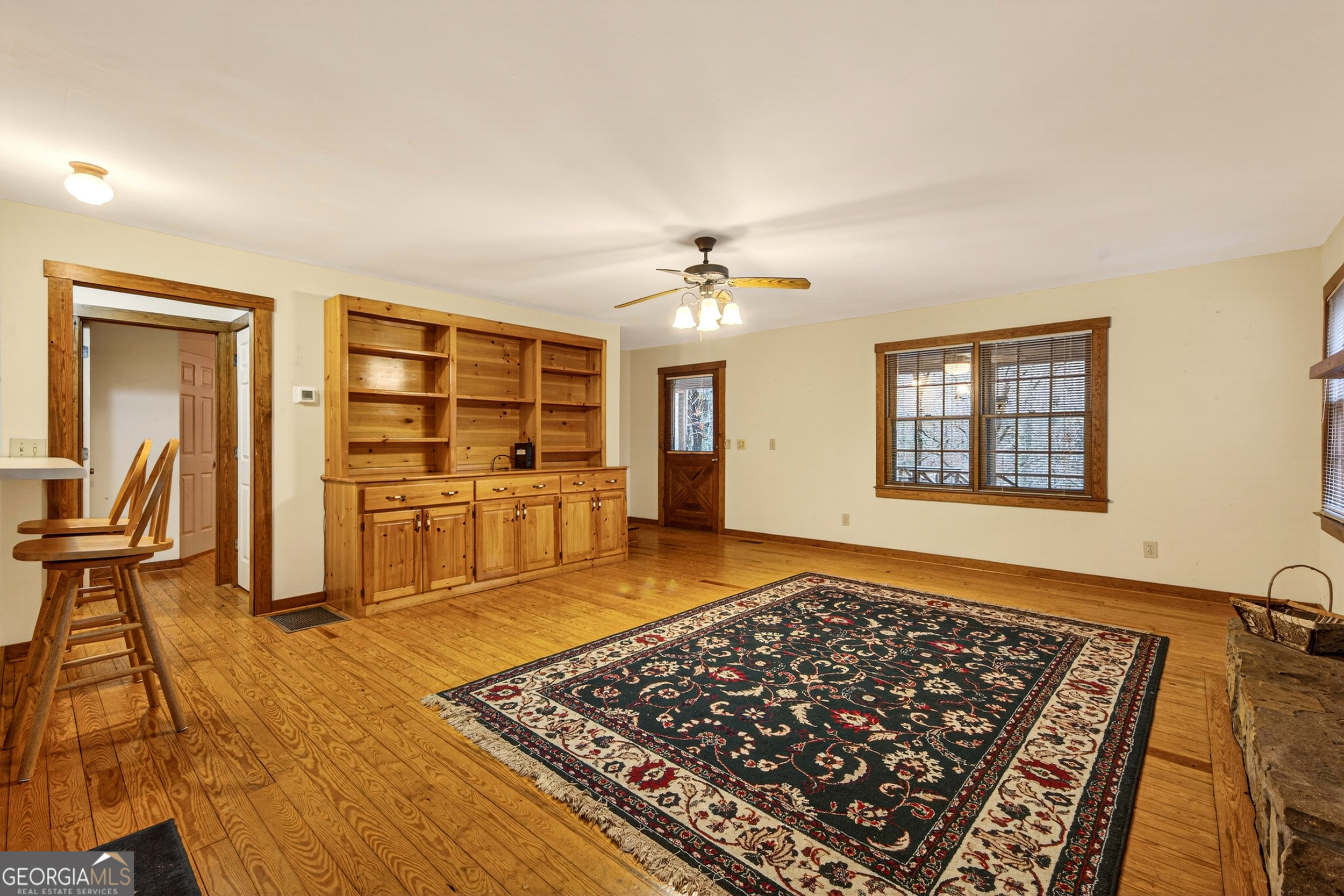1165 Sparks Branch Road Hiawassee, GA 30546 - Photo 6 of 31 a living room with a rug and a table