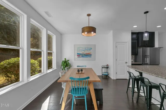a kitchen with a table and chairs in it