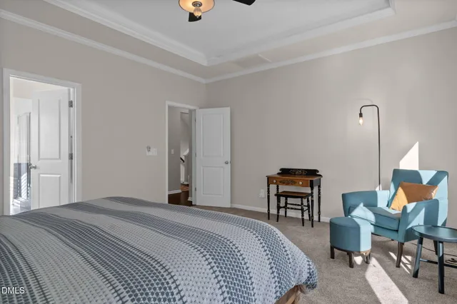 a bathroom with a granite countertop sink toilet mirror and shower