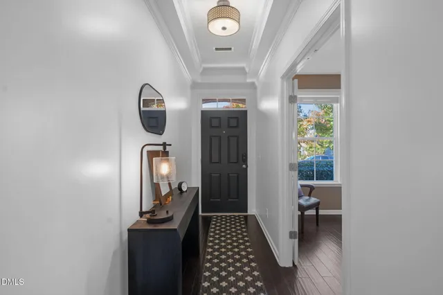 a view of hallway with wooden floor