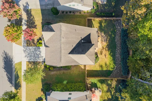 an aerial view of a house with a garden