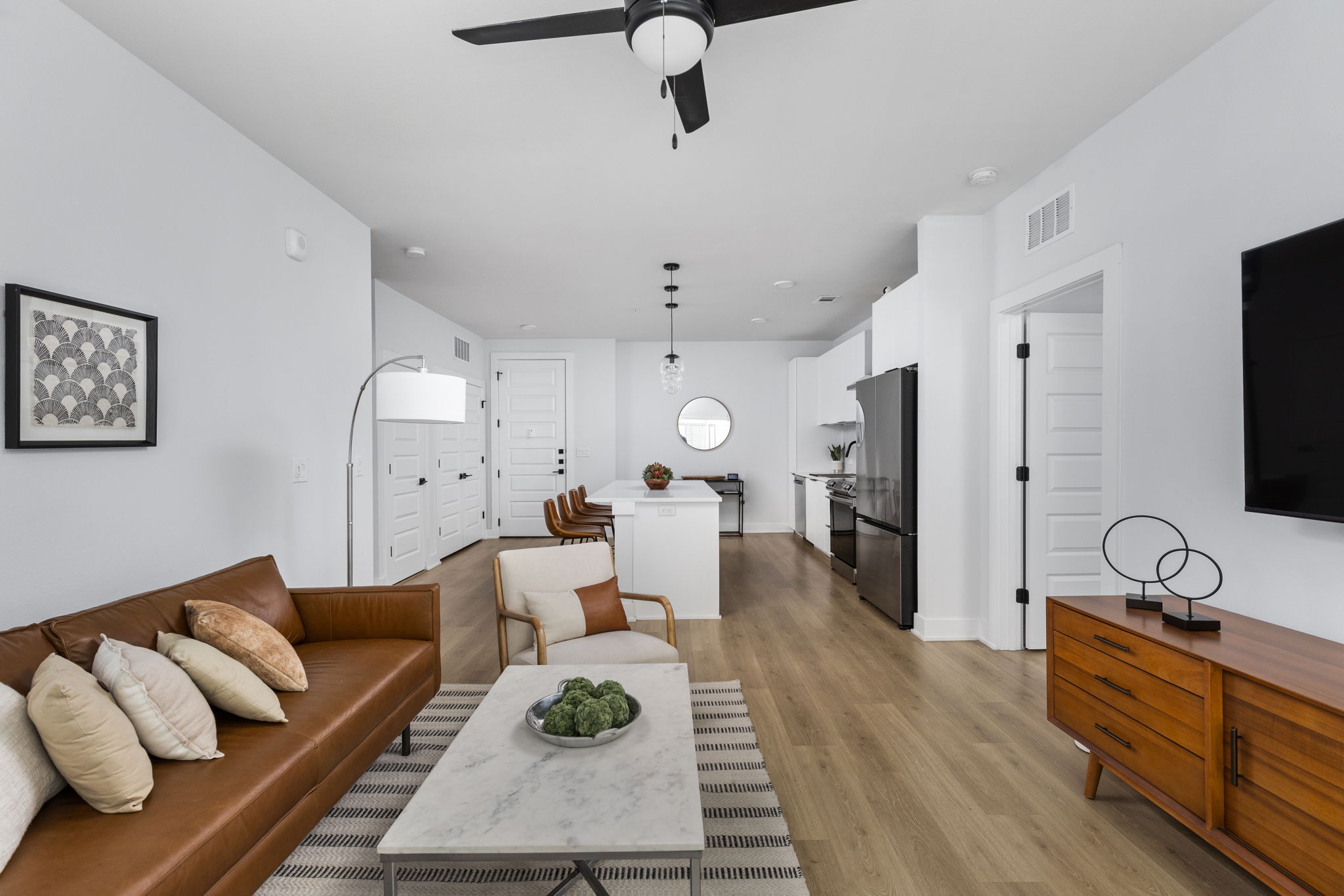 2500 Longview Street, Unit 507 Austin, TX 78705 - Photo 1 of 37 An open-concept living space seamlessly connects to the modern kitchen, promoting effortless flow and daily living.