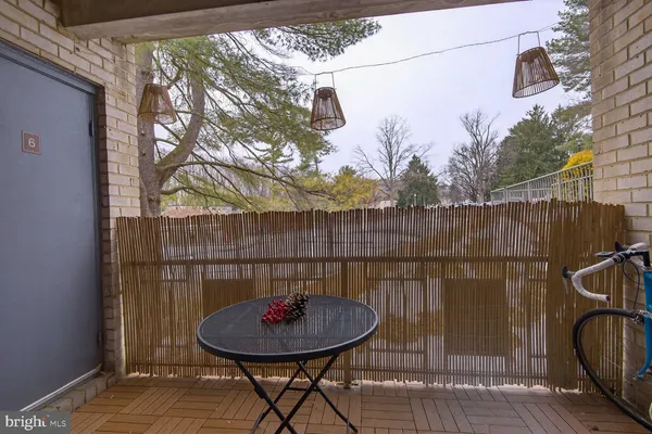 a view of a chair and table in the patio