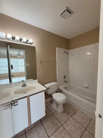 a bathroom with a sink toilet a mirror and shower