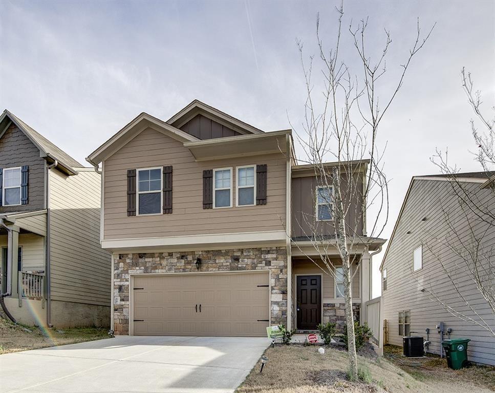 4999 Jack Drive Decatur, GA 30035 - Photo 1 of 1 a front view of a house with a garage