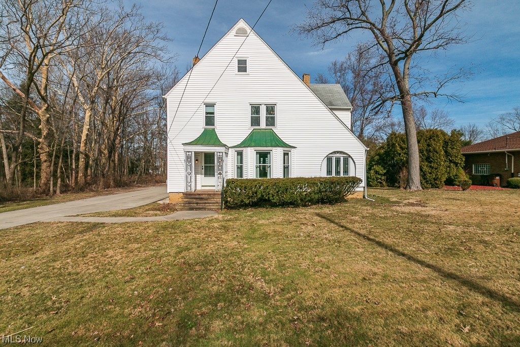 29396 Detroit Road Westlake, OH 44145 - Photo 2 of 30 Large front yard with extra wide driveway with additional parking area.