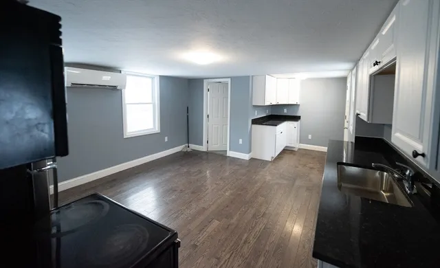 a view of a kitchen from the hallway