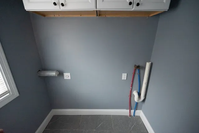 an empty room with a mirror