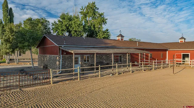 an aerial view of a residential houses with outdoor space