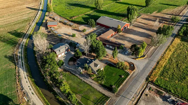 an aerial view of a house with outdoor space and street view
