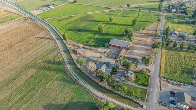 a dining room with furniture a fireplace and wooden floor