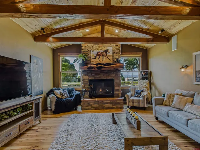 a view of a patio with a table and chairs