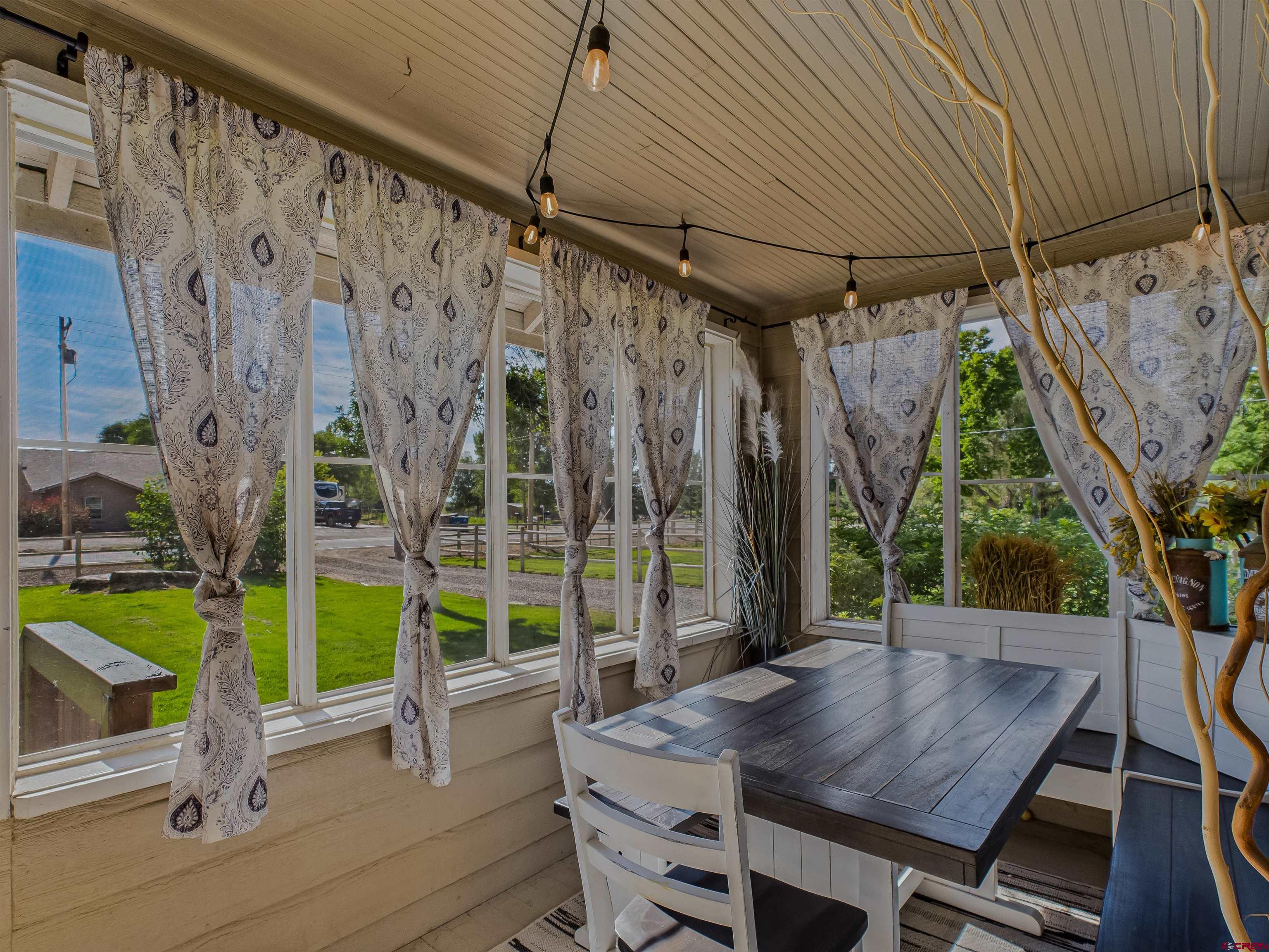 1577 14 1/2 Road Loma, CO 81524 - Photo 28 of 44 a view of a patio with a table and chairs