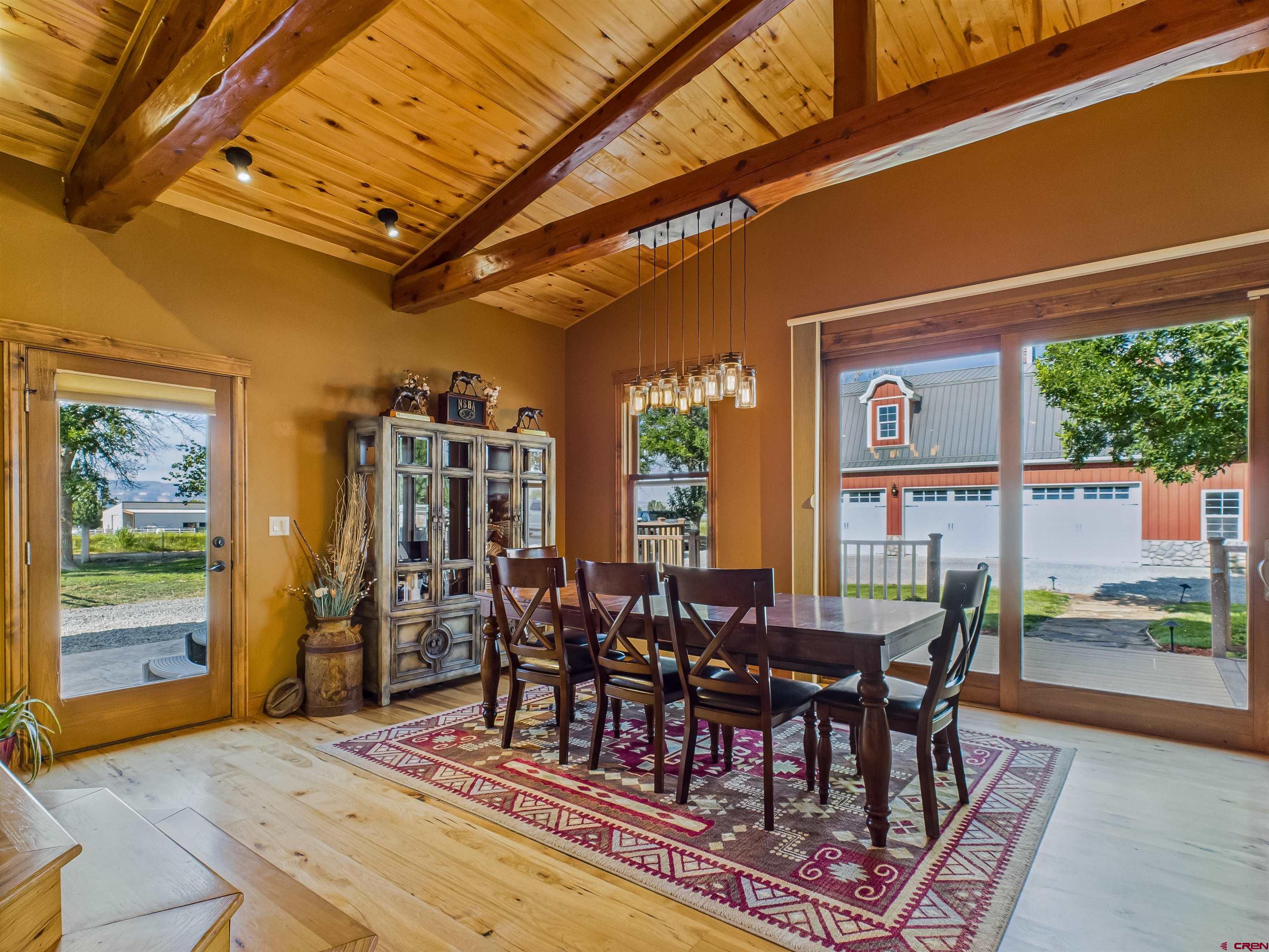 1577 14 1/2 Road Loma, CO 81524 - Photo 31 of 44 a view of a dining room with furniture window and wooden floor